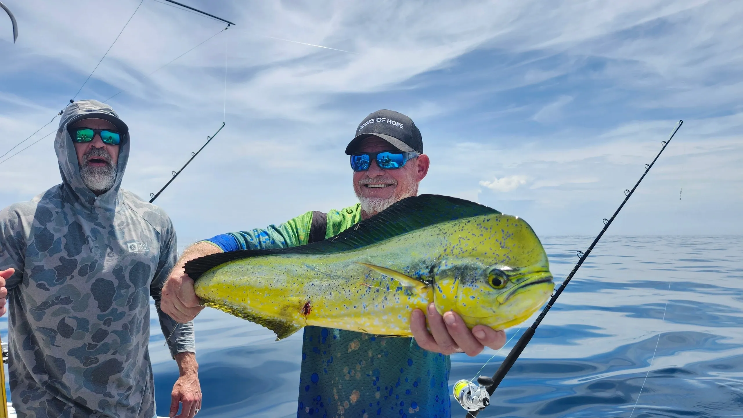Angler holding a freshly caught mahi-mahi